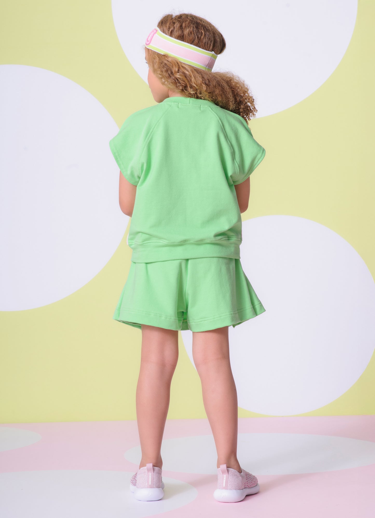 Saia Short Moletinho Pregas Patche Raquetes