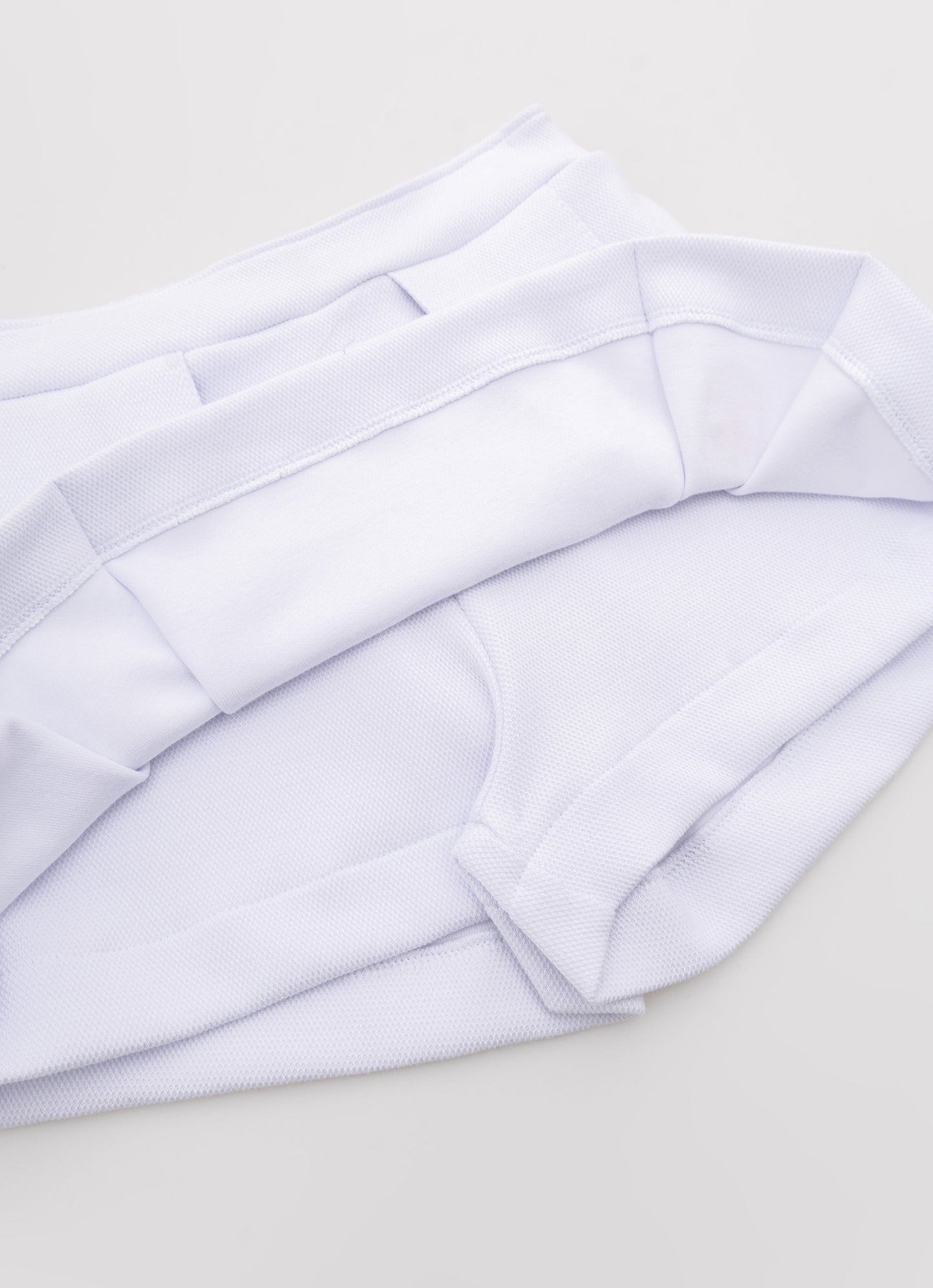 Saia Short Malha Piquet Pregas Patche