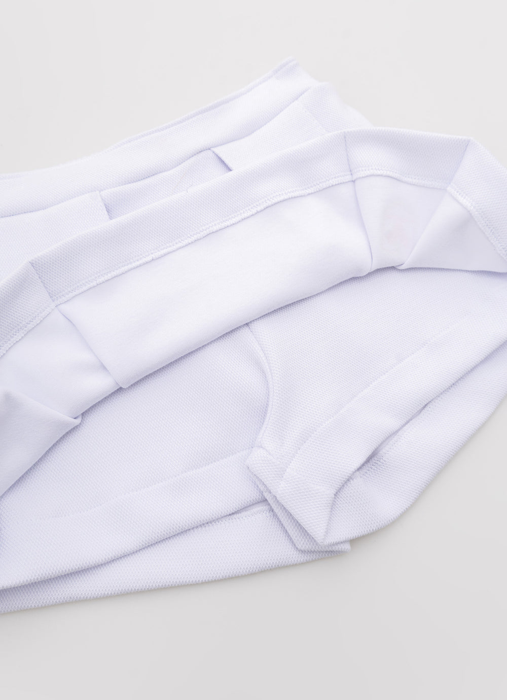 Saia Short Malha Piquet Pregas Patche